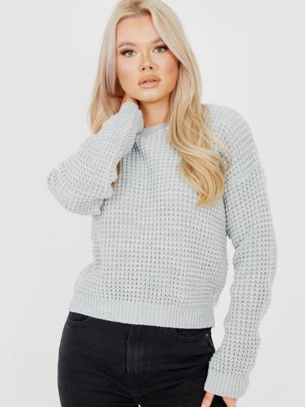 A stylish grey Crop Fisherman Jumper for women, featuring a knitted design and cropped length, perfect for casual and chic outfits.