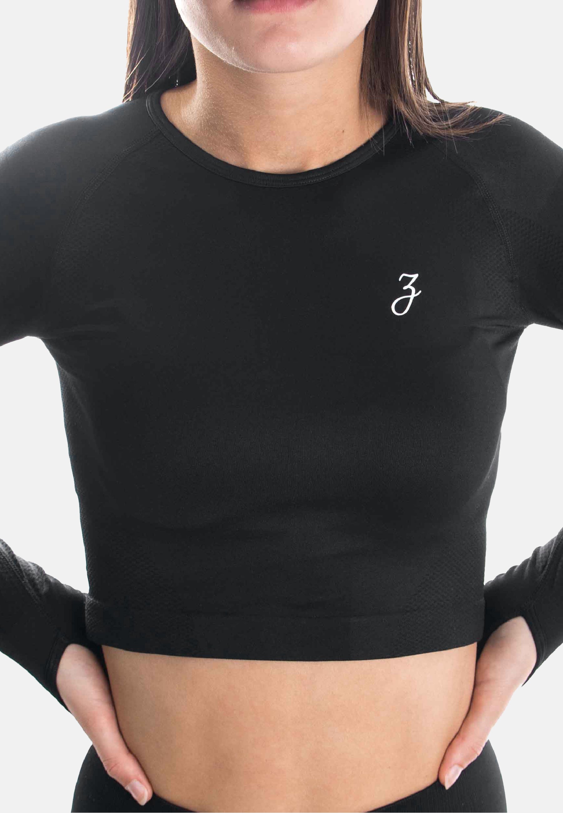 Schwarzes Crop Sleeve Dynamic für Damen, figurbetont und bequem, ideal für Sport und Freizeit.