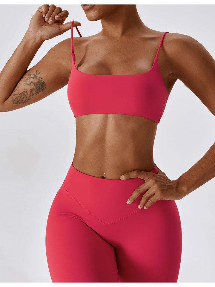 Cropped Sports Tank Top in solid color with spaghetti straps, showcasing a sporty design suitable for fitness activities.