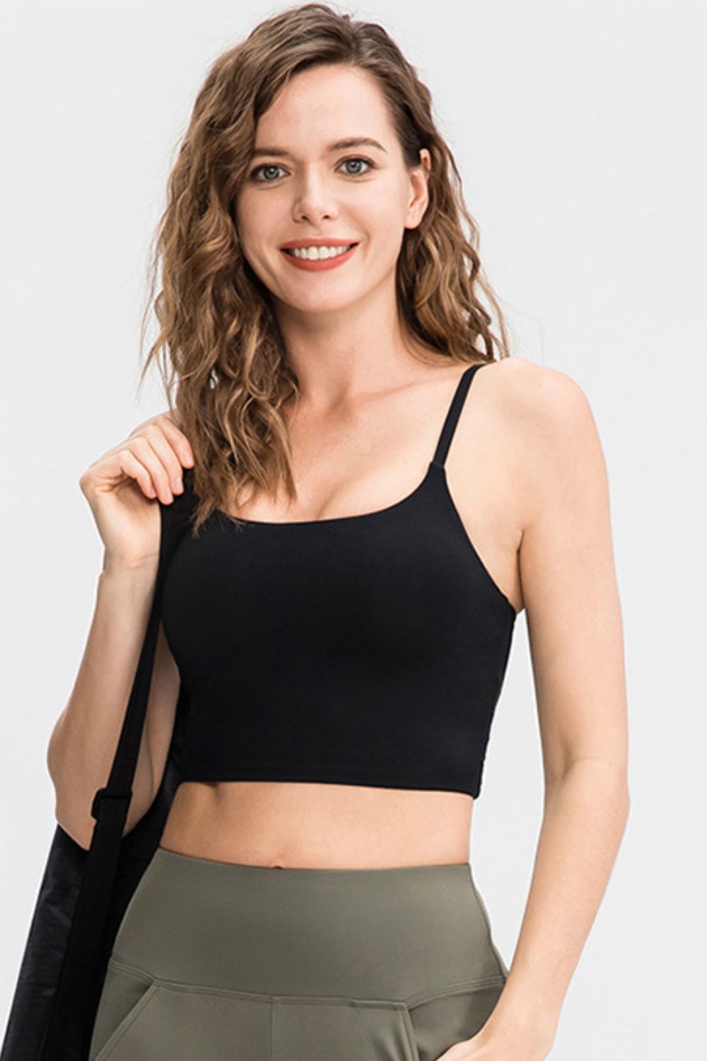 Cropped Yoga Tank Top in solid color with spaghetti straps and removable padding, showcasing its stylish scoop neck design.