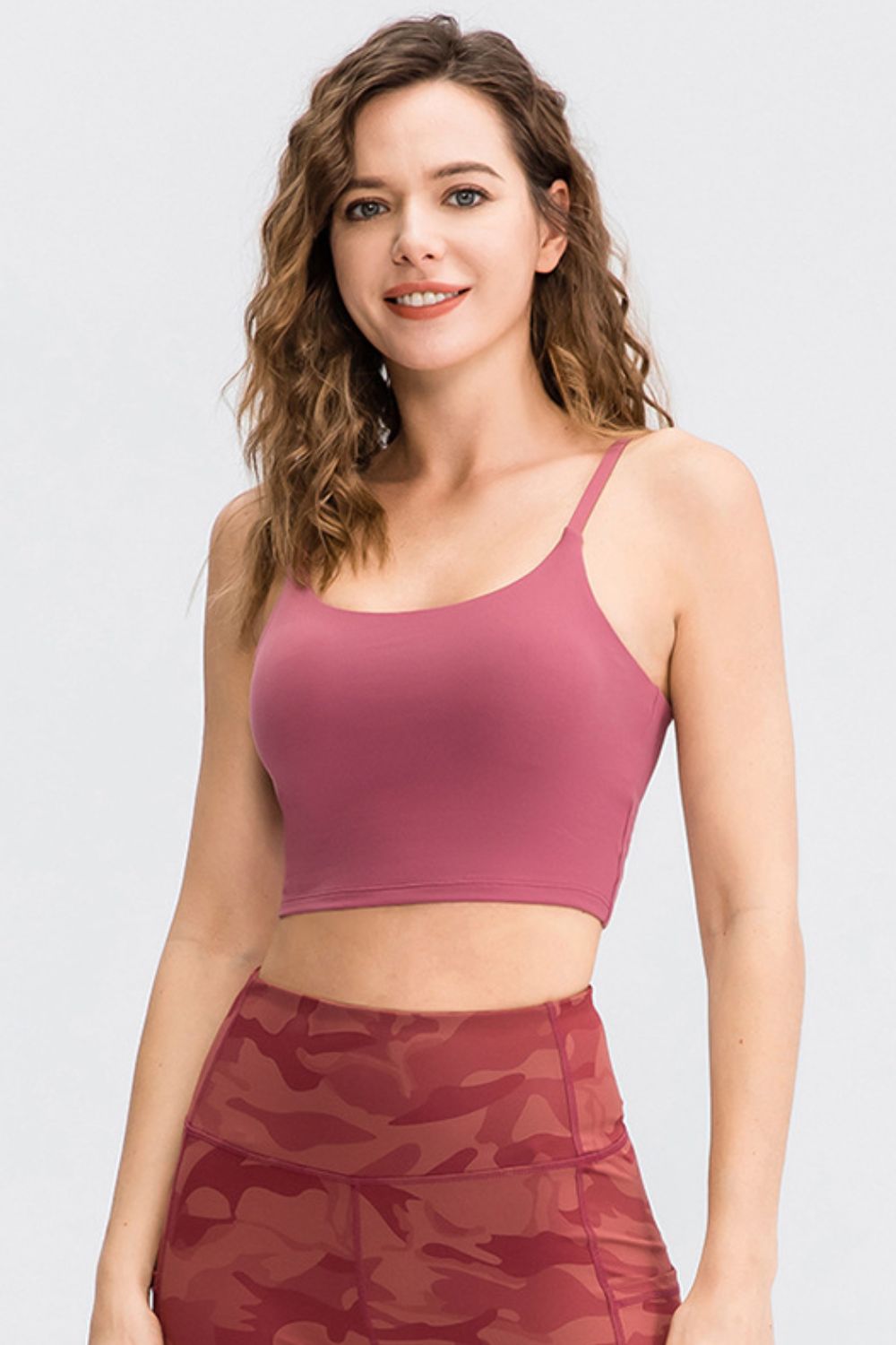 Cropped Yoga Tank Top in solid color with spaghetti straps and removable padding, showcasing its stylish scoop neck design.