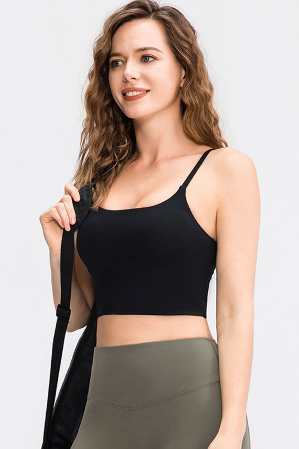 Cropped Yoga Tank Top in solid color with spaghetti straps and removable padding, showcasing its stylish scoop neck design.