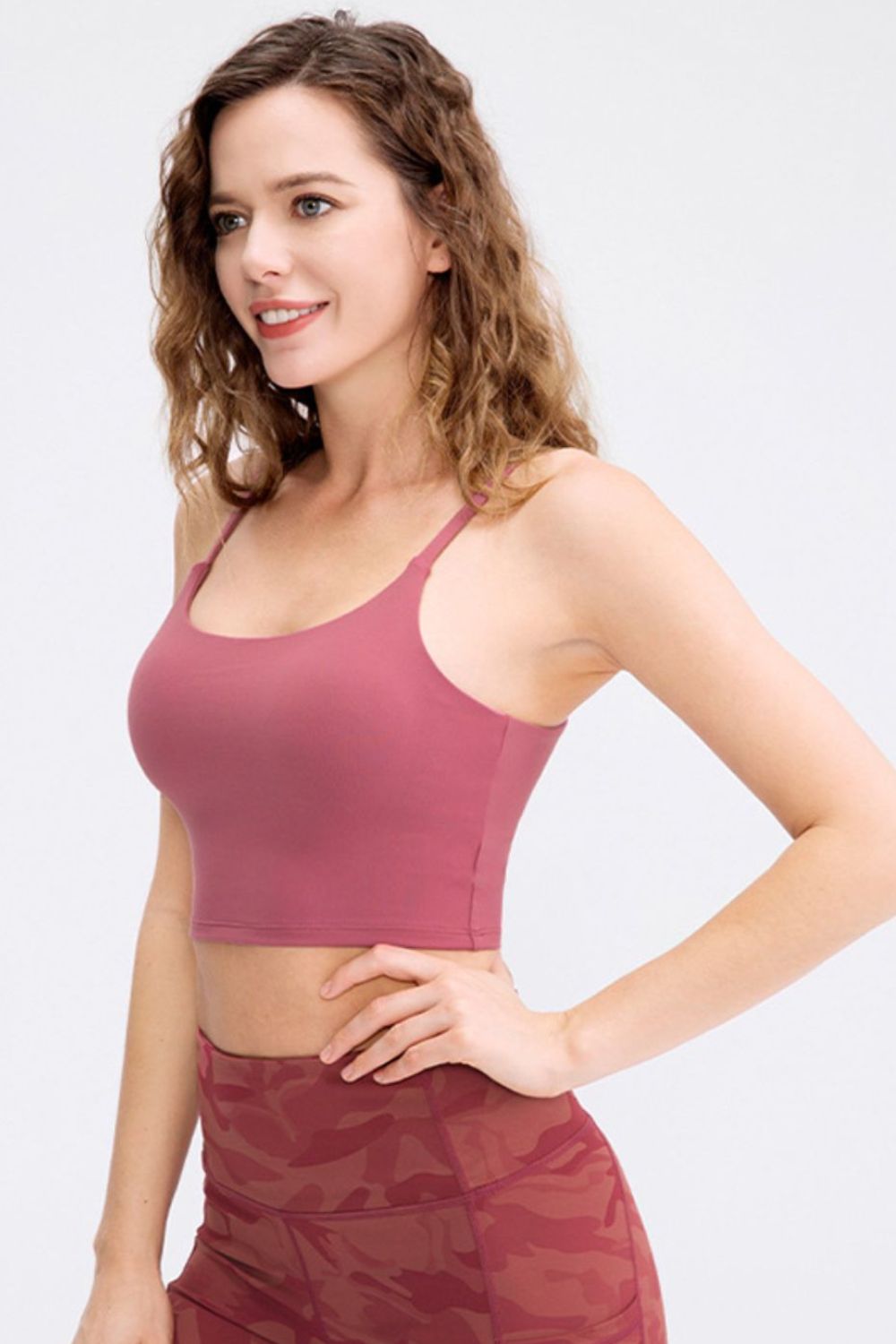 Cropped Yoga Tank Top in solid color with spaghetti straps and removable padding, showcasing its stylish scoop neck design.