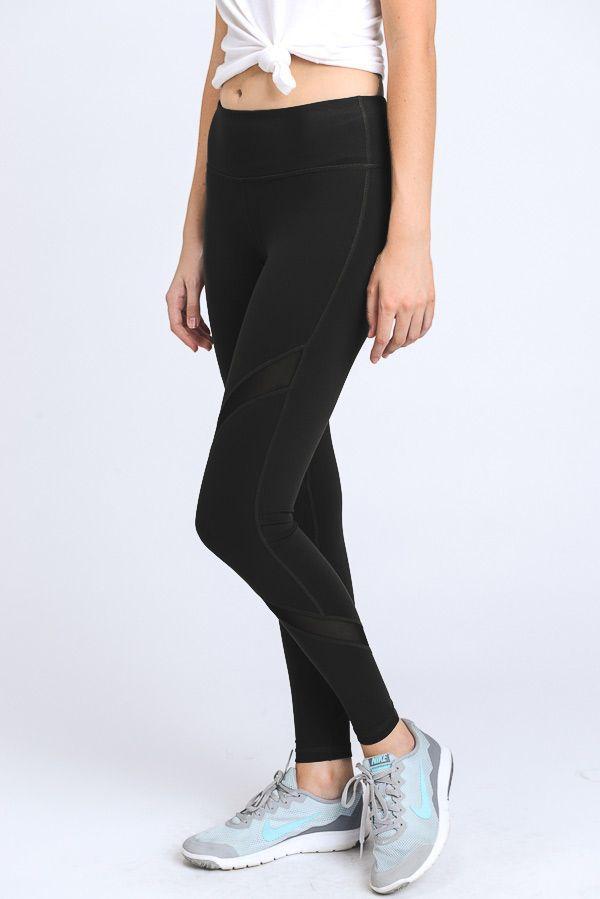 A pair of stylish black cross mesh leggings featuring slanted mesh panels and a zipper pocket on the back.