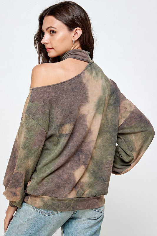 A stylish CUT OUT TIE DYE TOP featuring a vibrant tie-dye pattern, cut-out shoulder design, mock neck, and balloon sleeves.