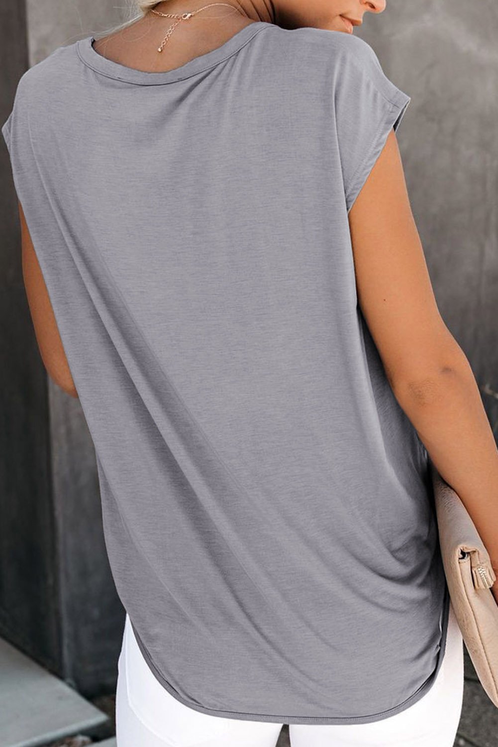 A stylish Cut Out T-shirt featuring a round neck, short sleeves, and unique cut-out details, made from soft cotton knit fabric.