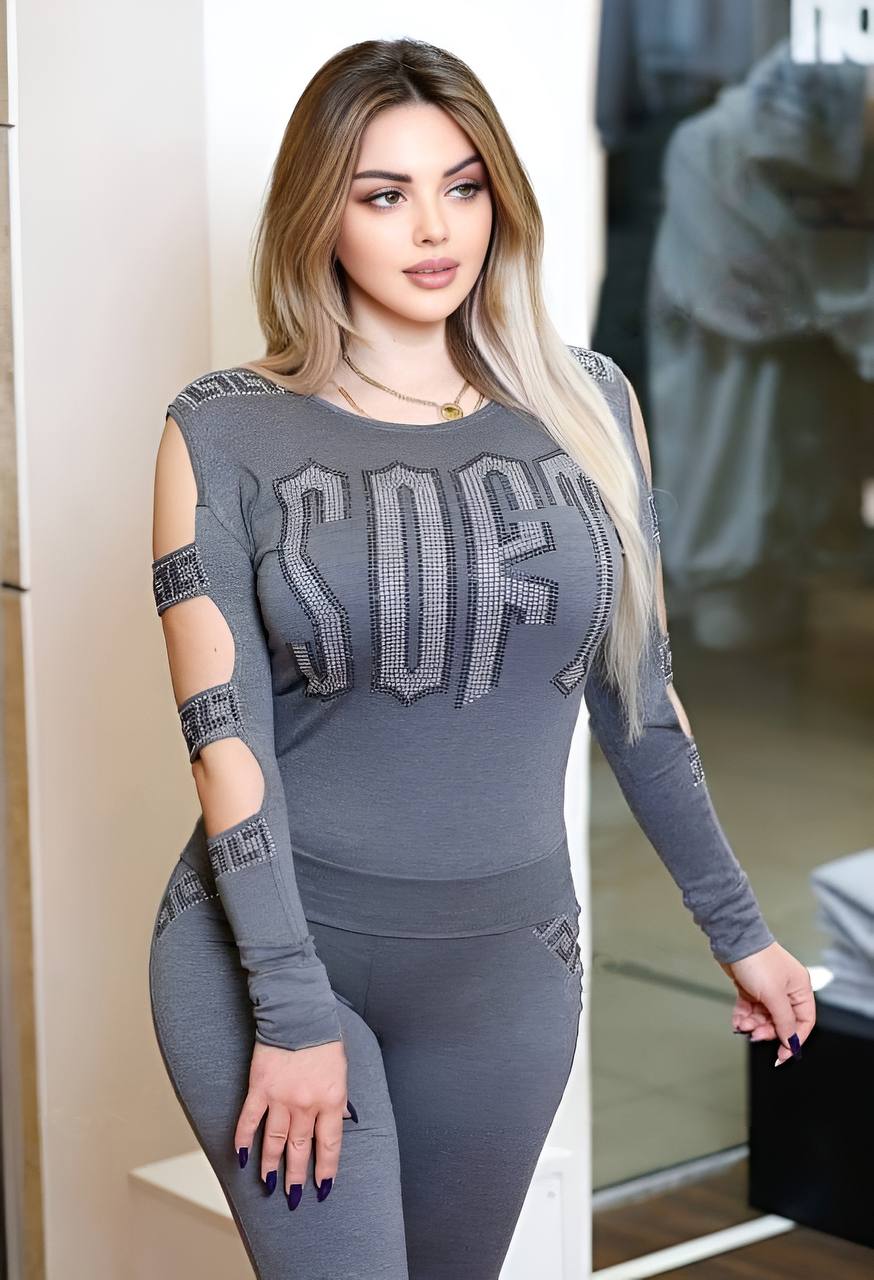 A stylish cutout long sleeved top paired with stretchy leggings, showcasing a modern and comfortable outfit.