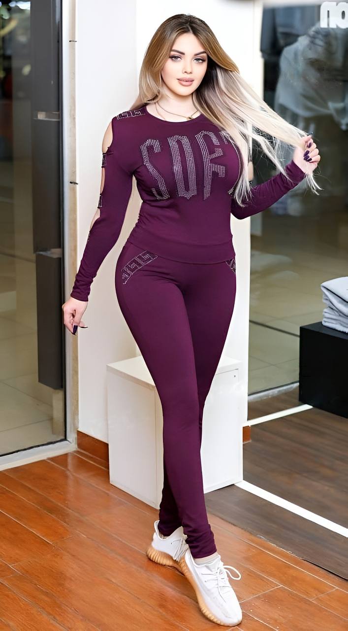 A stylish cutout long sleeved top paired with stretchy leggings, showcasing a modern and comfortable outfit.