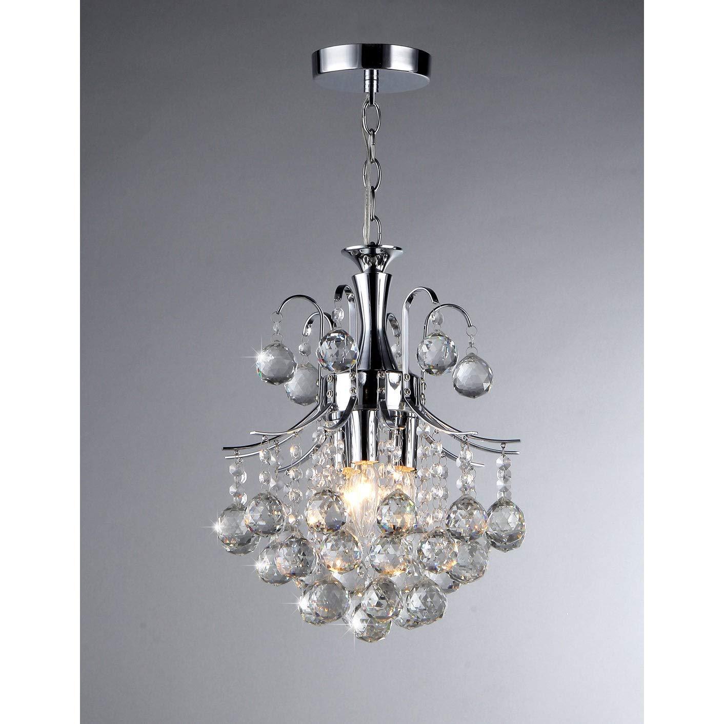 Cyan 3-light Crystal Chandelier with silvery chrome base and sparkling crystal charms, elegantly illuminating a stylish interior.