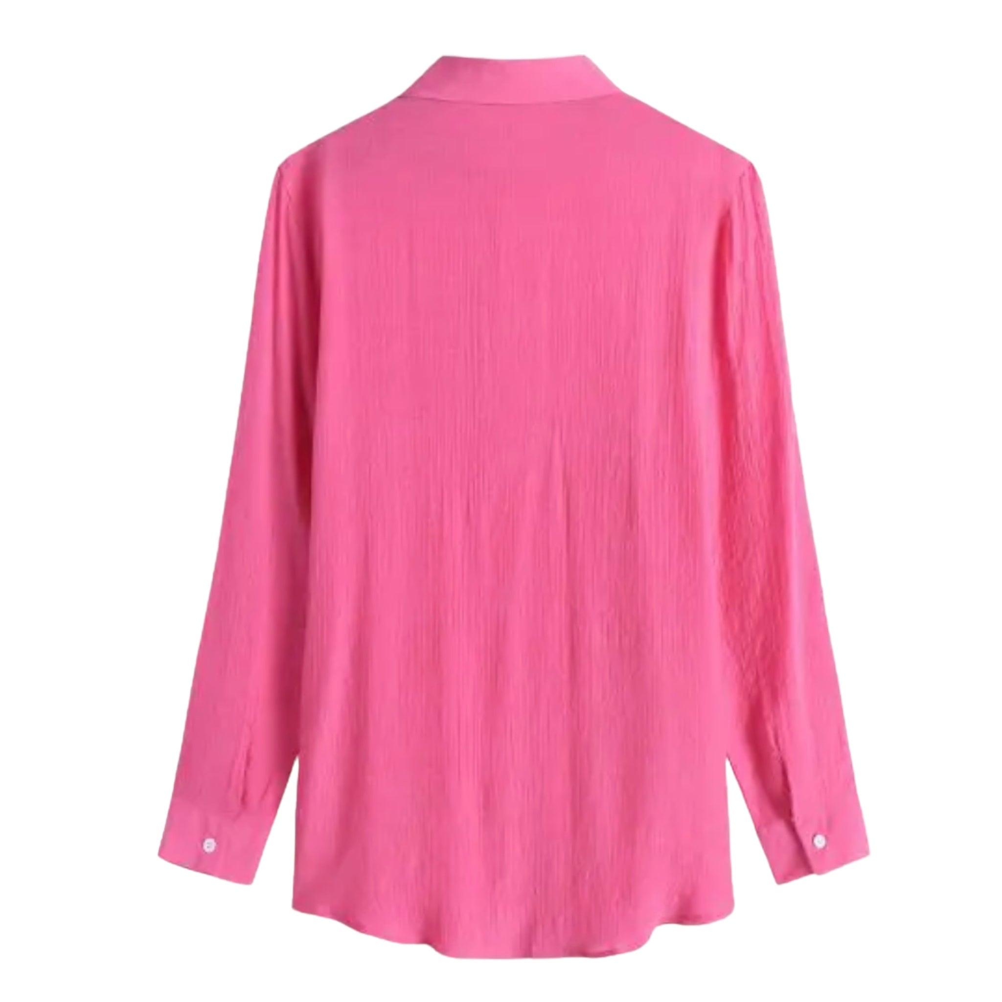 Daisy long sleeve swimwear cover-up featuring a collar and pocket, made from semi-sheer polyester and viscose fabric.