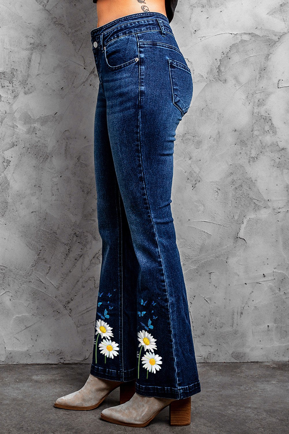 Daisy Print High Waist Flare Jeans showcasing a stylish floral pattern and a flattering high waist design.