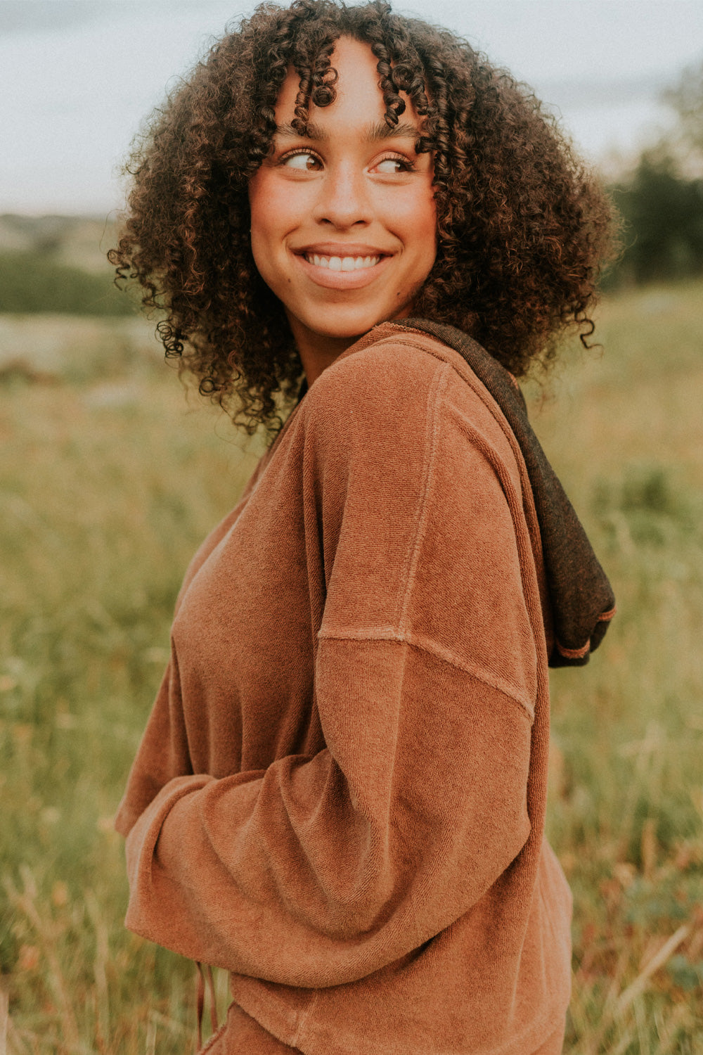 Dance With Life Hoodie in vibrant colors, featuring a soft v-neck and modern seam details, made from 100% organic cotton.