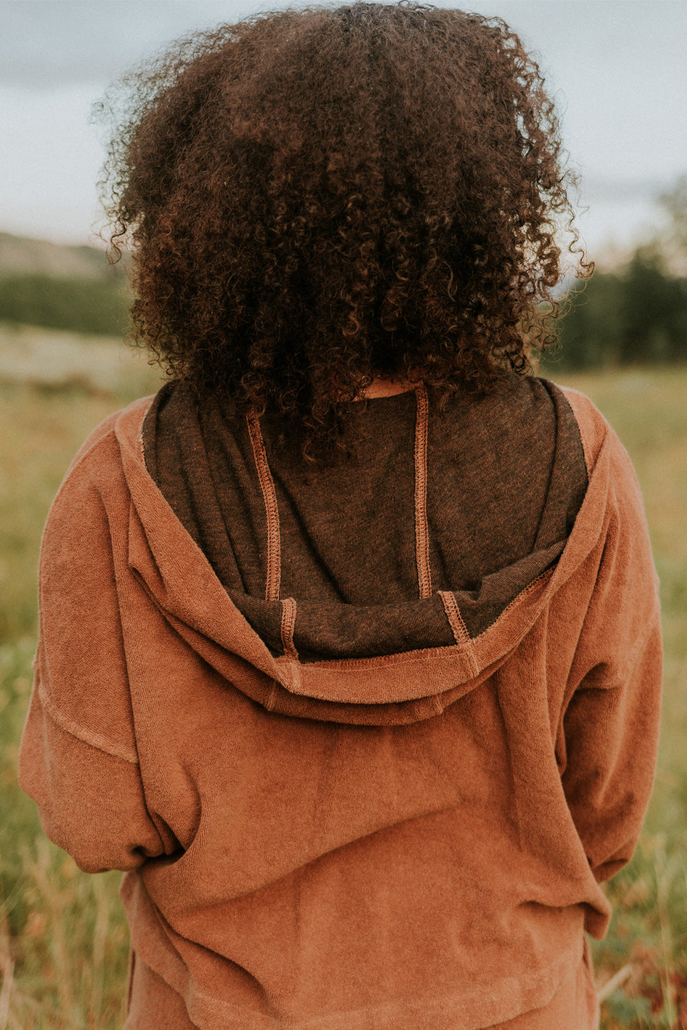 Dance With Life Hoodie in vibrant colors, featuring a soft v-neck and modern seam details, made from 100% organic cotton.