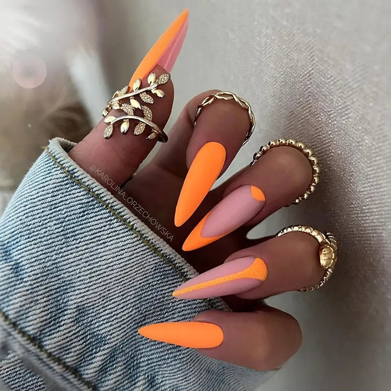 Dancing with Fire Nails featuring a matte finish, oval shape, and striped pattern, showcasing a stylish press-on nail design.