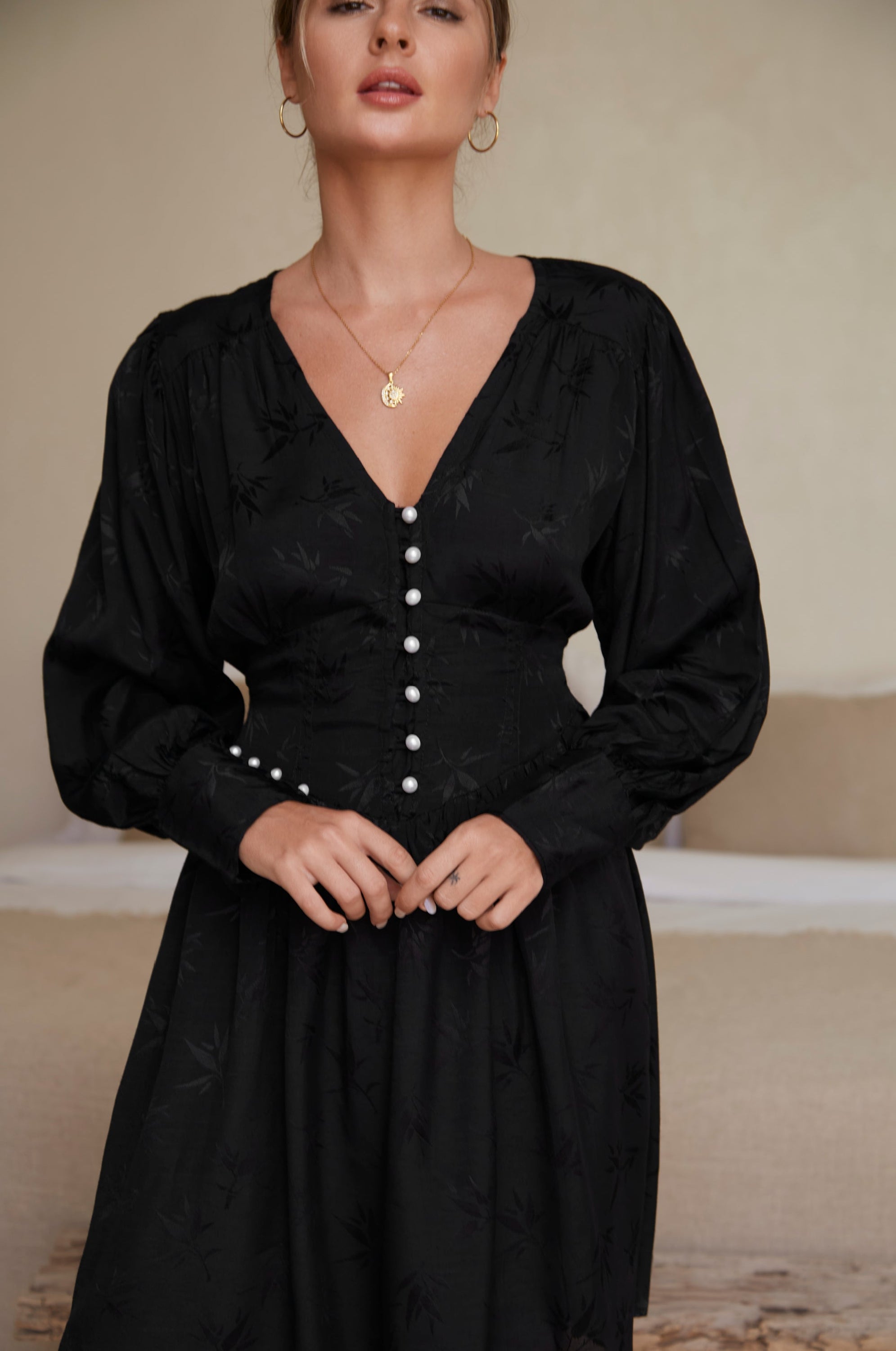 Daphne Floaty Long Sleeve Mini Dress featuring a romantic silhouette, voluminous sleeves, and pearl button details, made from soft organic cotton.