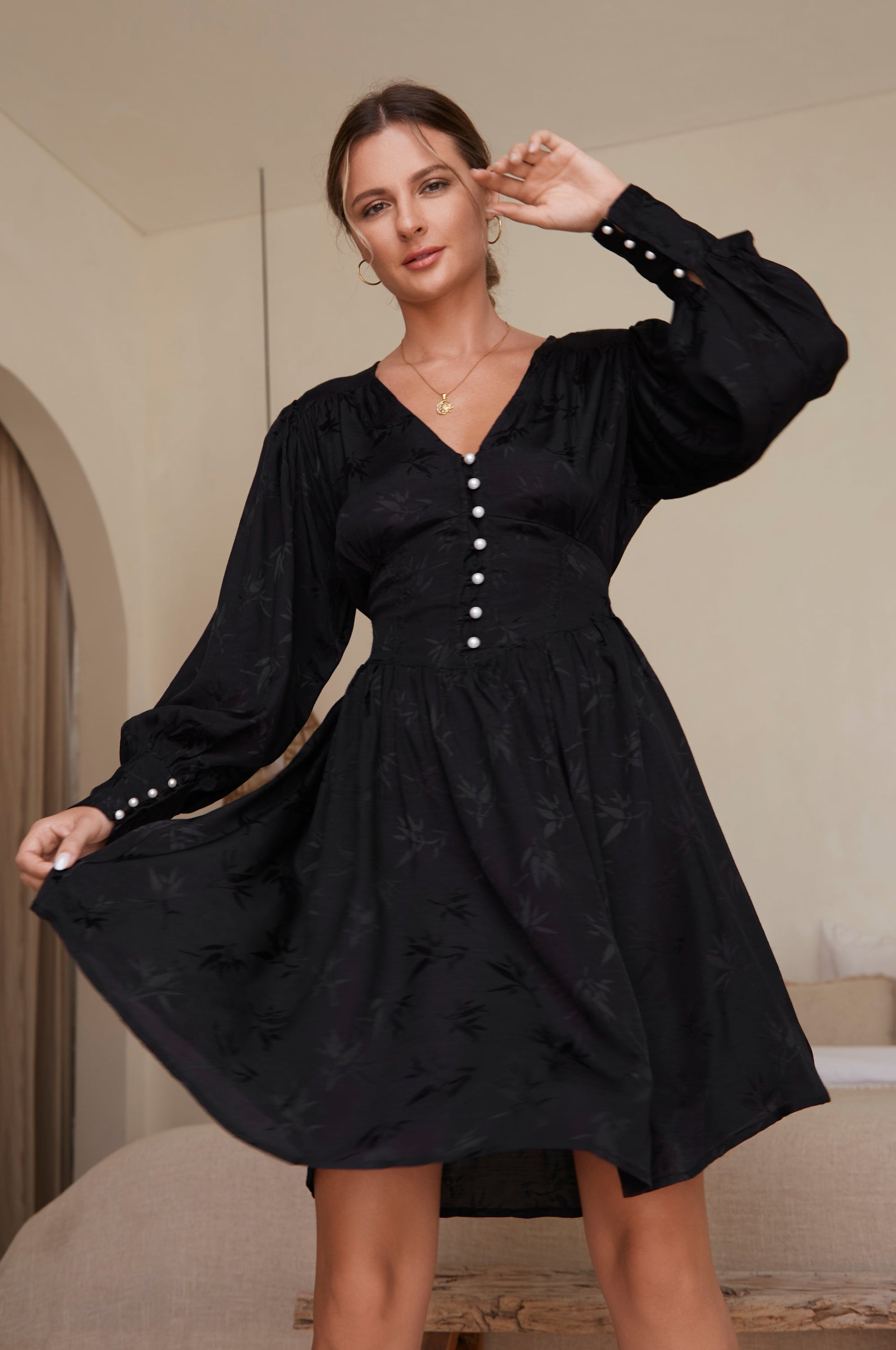 Daphne Floaty Long Sleeve Mini Dress featuring a romantic silhouette, voluminous sleeves, and pearl button details, made from soft organic cotton.