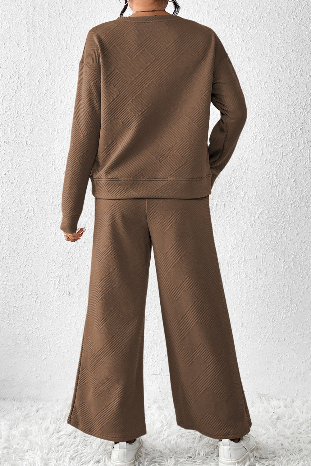 Dark brown ultra loose textured 2-piece slouchy outfit featuring a long-sleeved top and wide-leg pants with drawstrings.