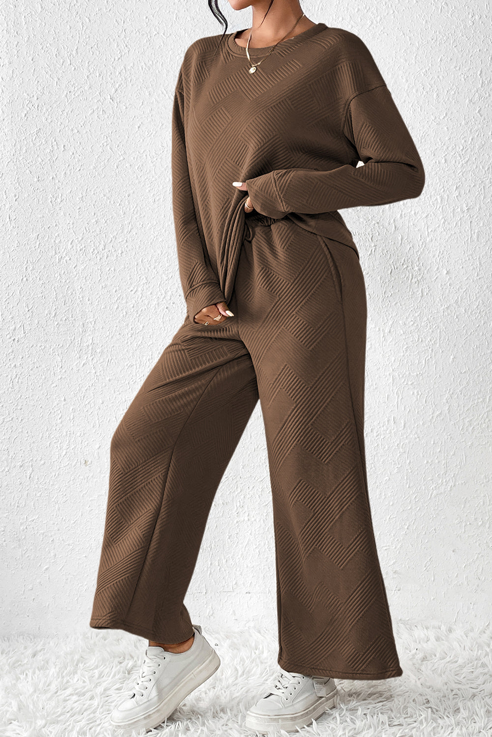 Dark brown ultra loose textured 2-piece slouchy outfit featuring a long-sleeved top and wide-leg pants with drawstrings.