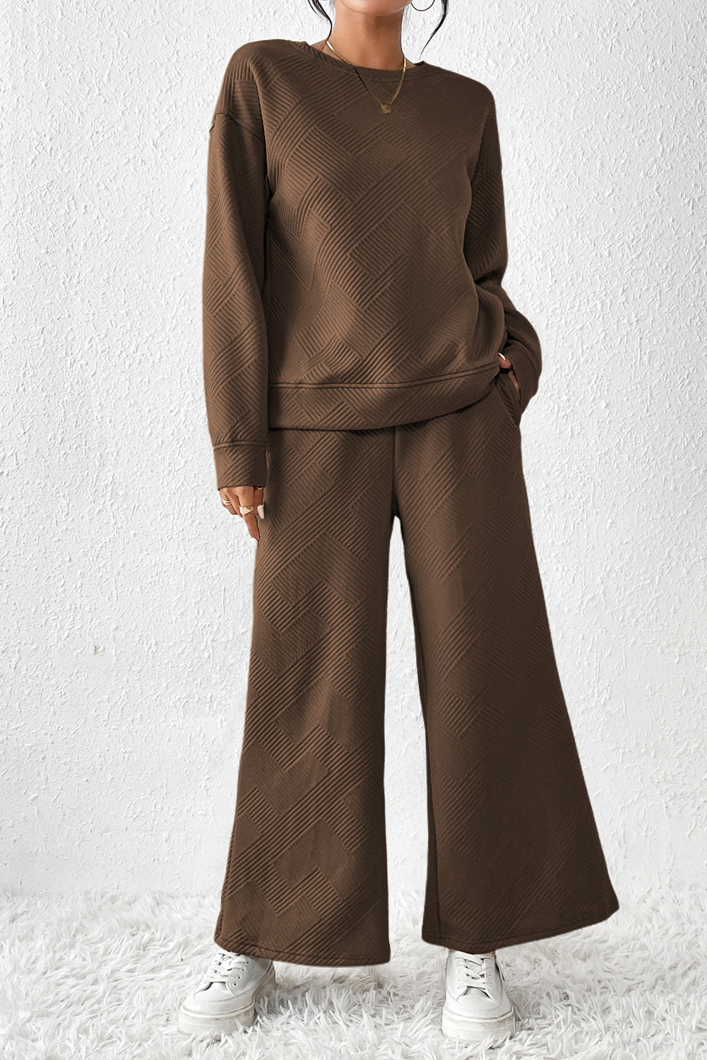 Dark brown ultra loose textured 2-piece slouchy outfit featuring a long-sleeved top and wide-leg pants with drawstrings.