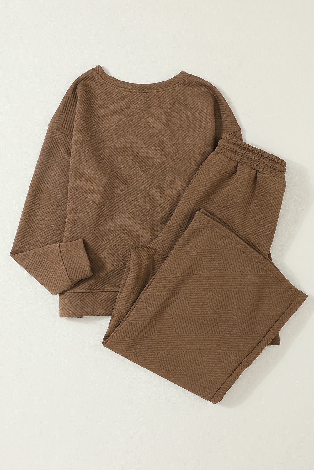 Dark brown ultra loose textured 2-piece slouchy outfit featuring a long-sleeved top and wide-leg pants with drawstrings.