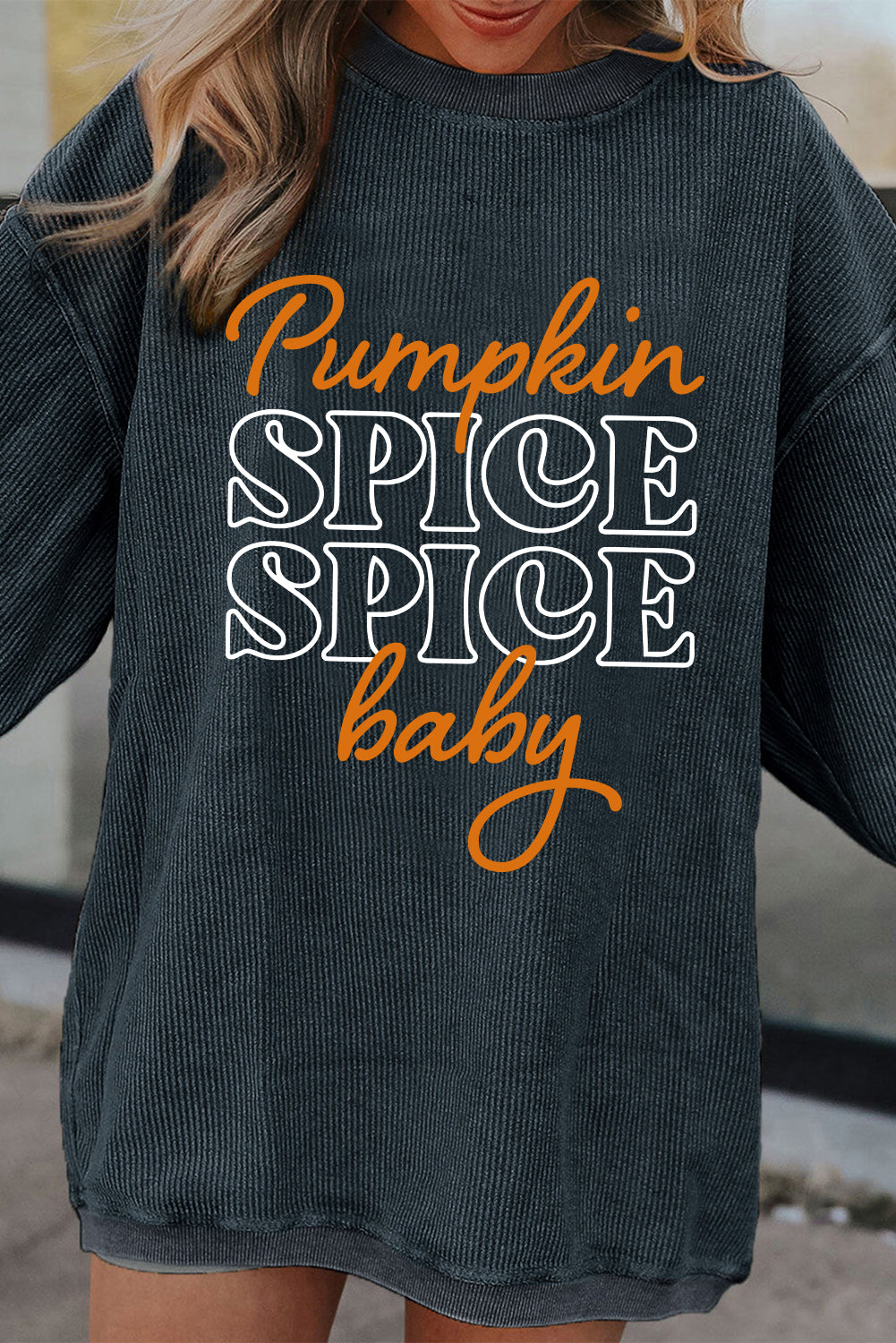 Dark grey textured sweatshirt featuring a playful pumpkin spice baby graphic, perfect for Halloween.