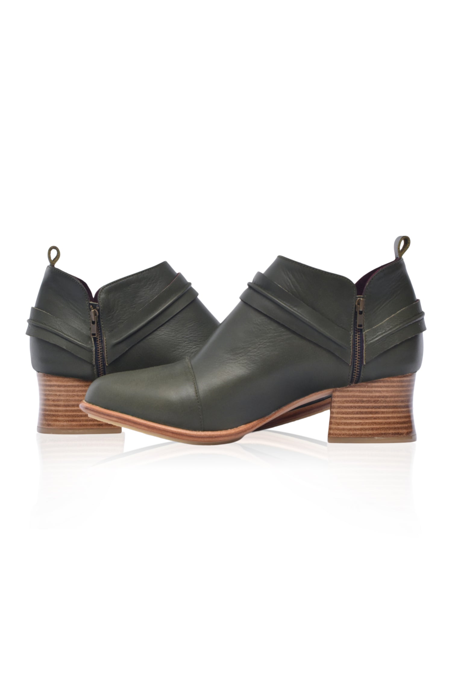 Dasha Low Ankle Booties in genuine leather with wild-west strap detailing, showcasing a stylish low-cut silhouette and a stacked wooden block heel.