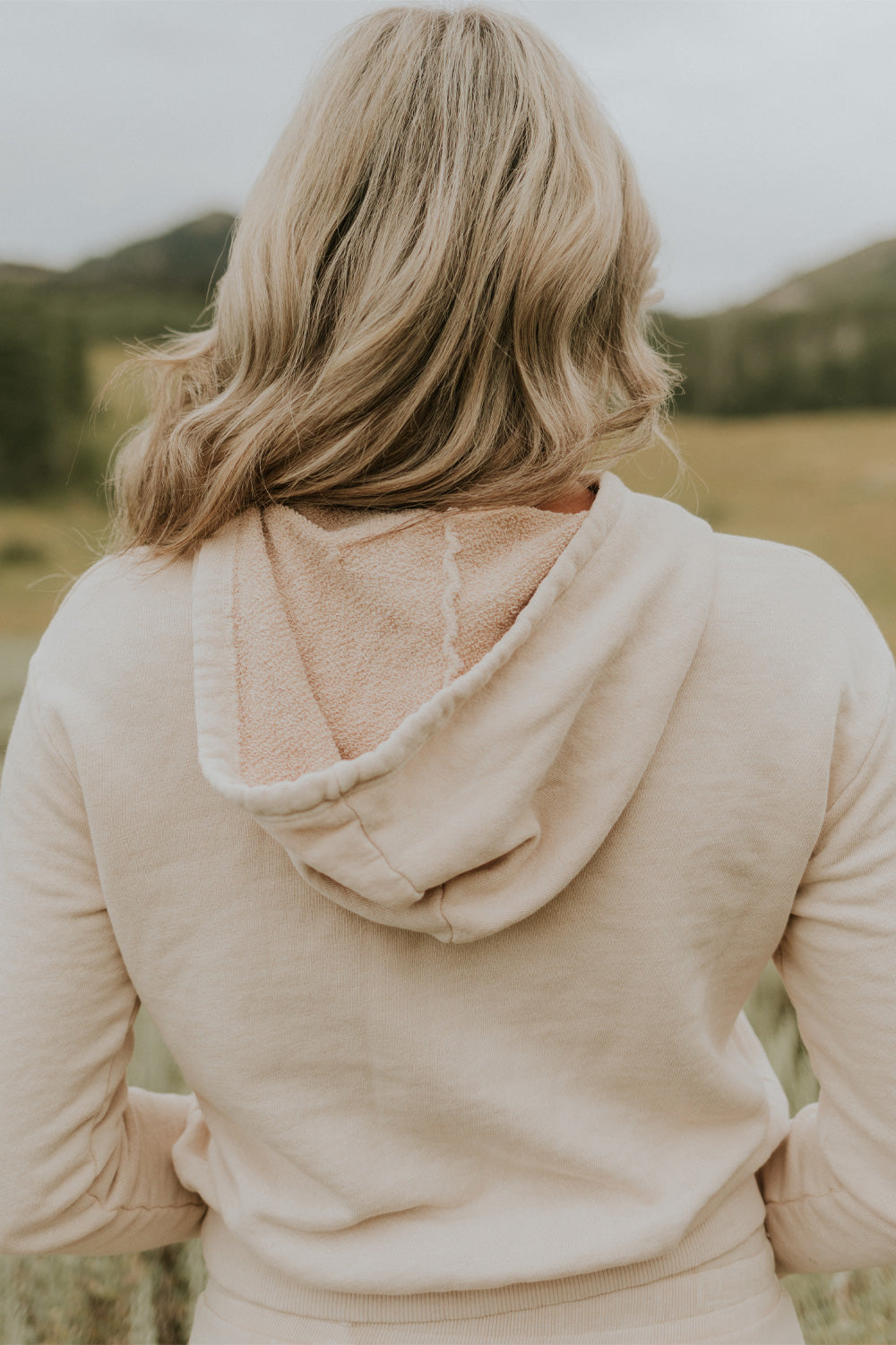 Day Break Hoodie 2.0 in Cream, showcasing its vintage cropped design and soft organic cotton fabric.