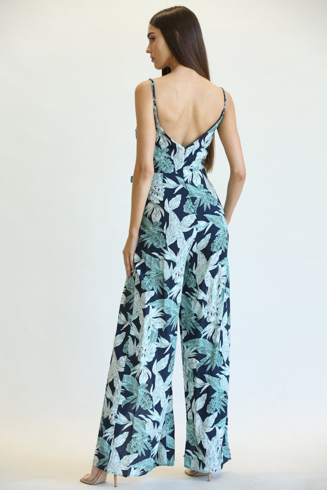 Delen Leaf/Palm Print Pattern Jumpsuit featuring a vibrant tropical design, surplice V-neckline, and adjustable shoulder straps.