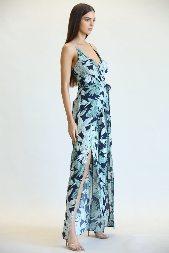 Delen Leaf/Palm Print Pattern Jumpsuit featuring a vibrant tropical design, surplice V-neckline, and adjustable shoulder straps.