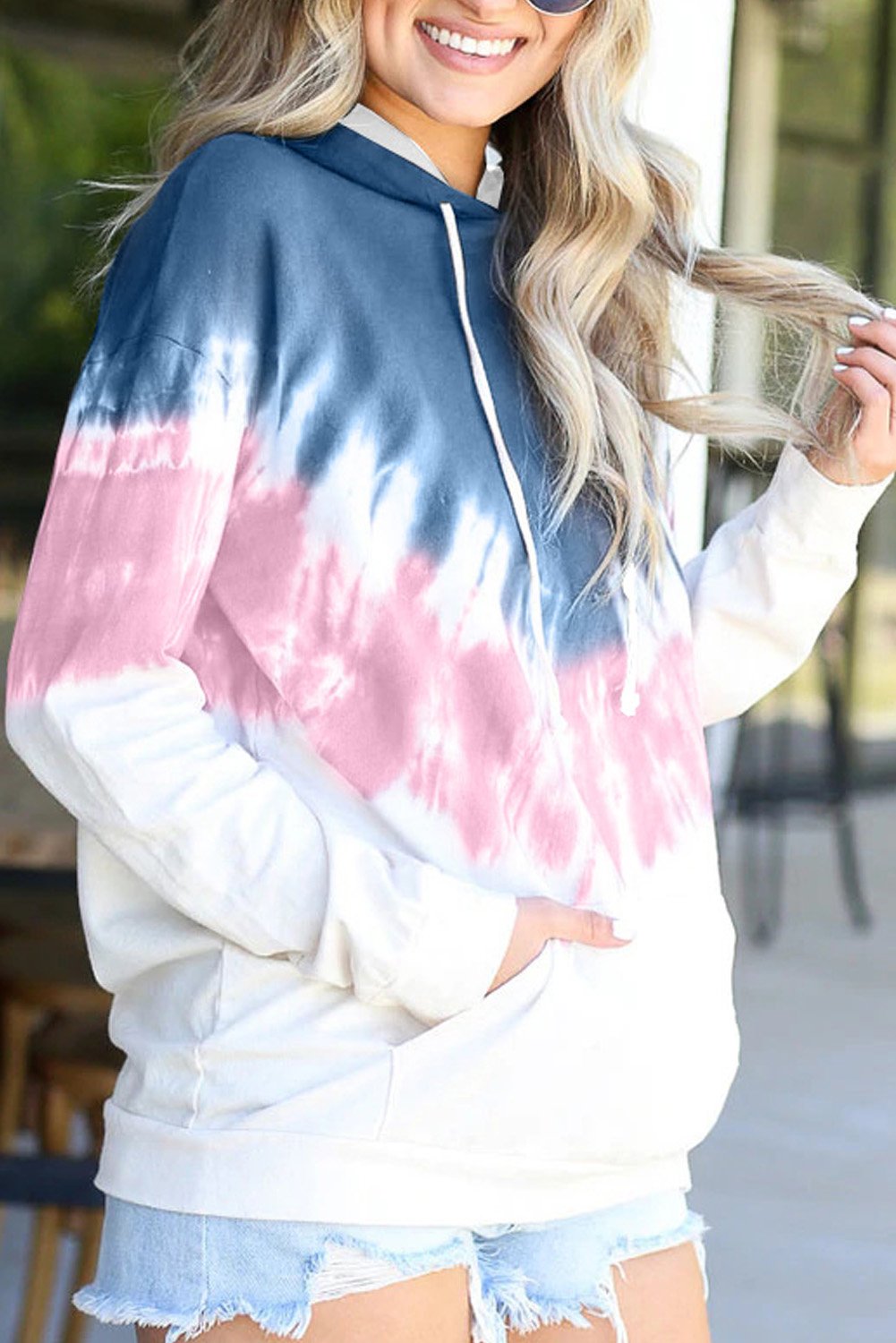 Demi Tie-dye Hoodie featuring a stylish tie-dye print, oversized fit, and kangaroo pocket, perfect for casual wear.