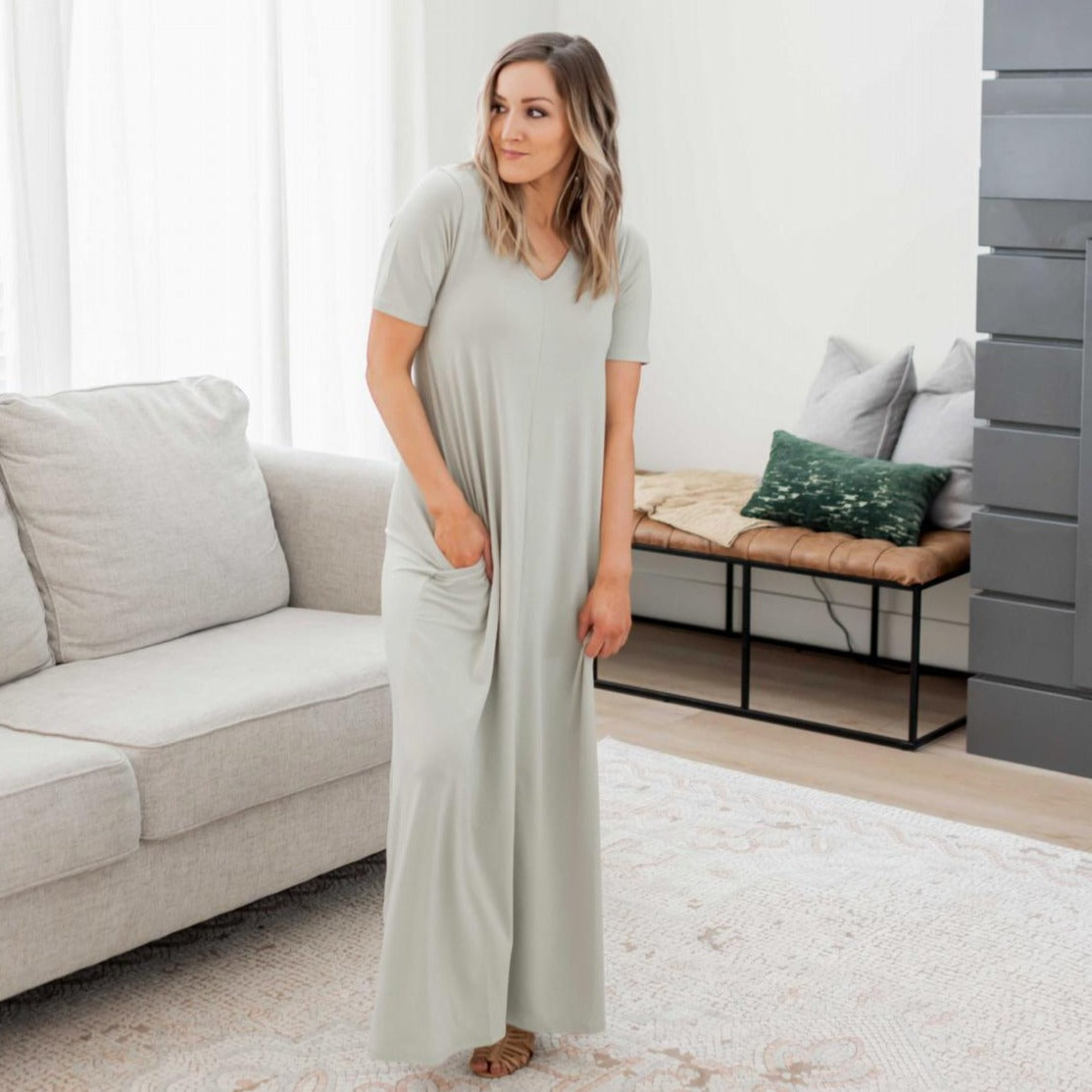 Demure V-Neck Maxi Dress featuring a flattering design with pockets, made from soft stretchy fabric, perfect for all seasons.