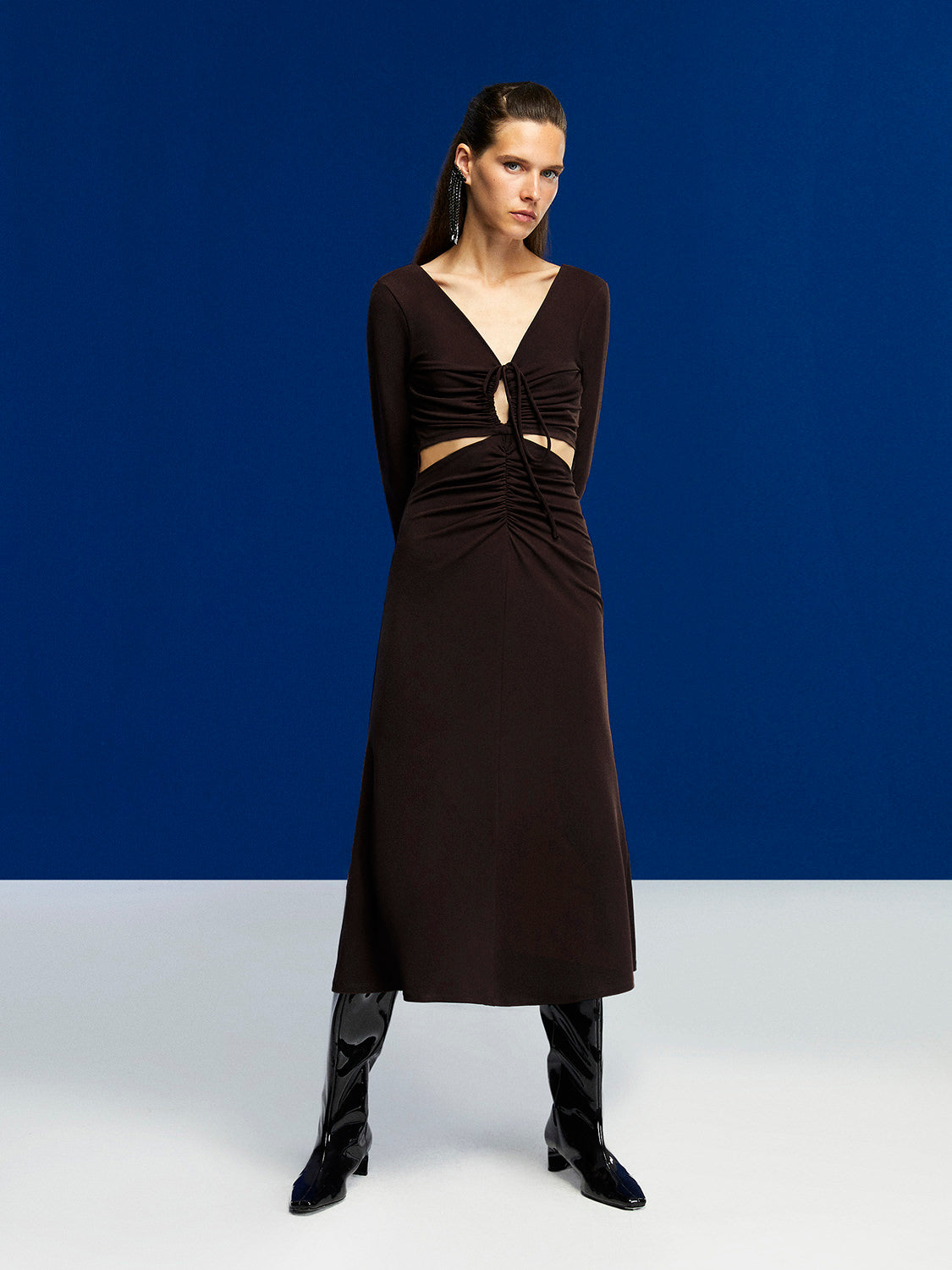 A stylish Deep V-Neck Midi Dress in Neo Brown with long sleeves, open back, and flounced hem, perfect for winter occasions.