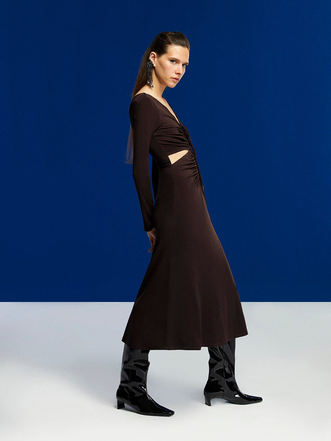 A stylish Deep V-Neck Midi Dress in Neo Brown with long sleeves, open back, and flounced hem, perfect for winter occasions.