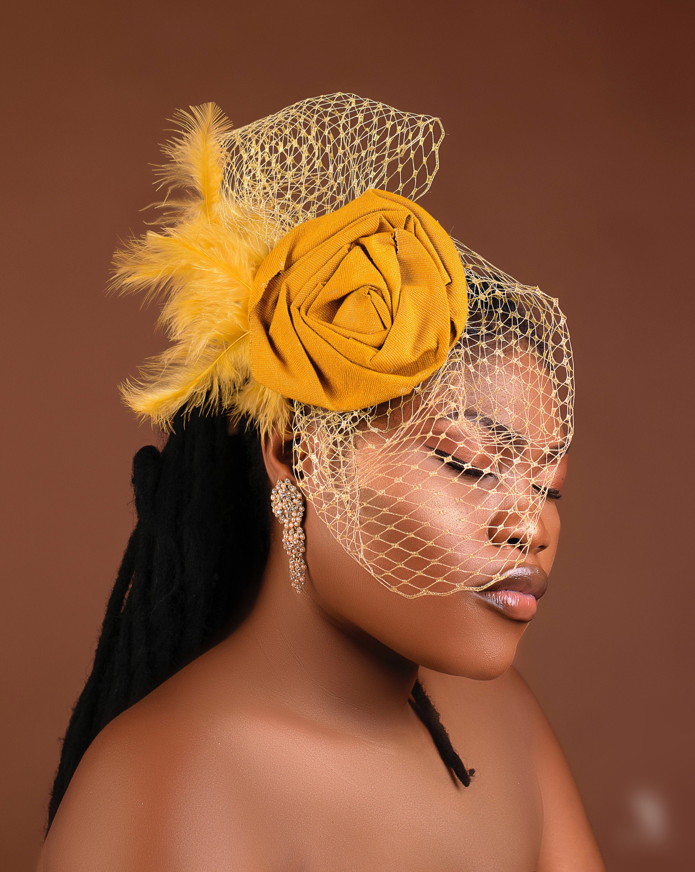 Dera Fascinator made from asooke gele with birdcage net, showcasing a unique and elegant design for African events.