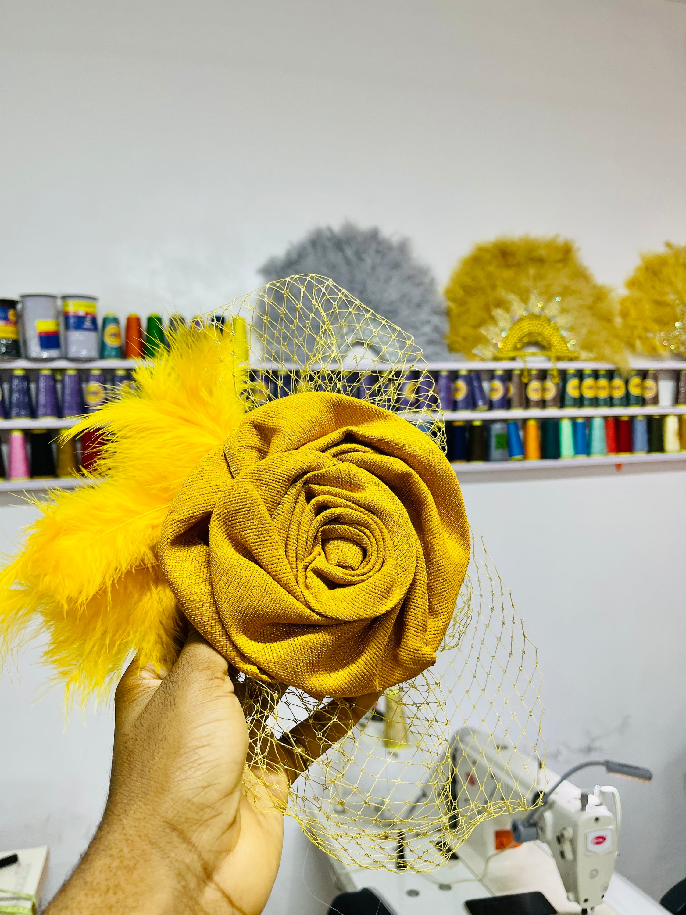 Dera Fascinator made from asooke gele with birdcage net, showcasing a unique and elegant design for African events.