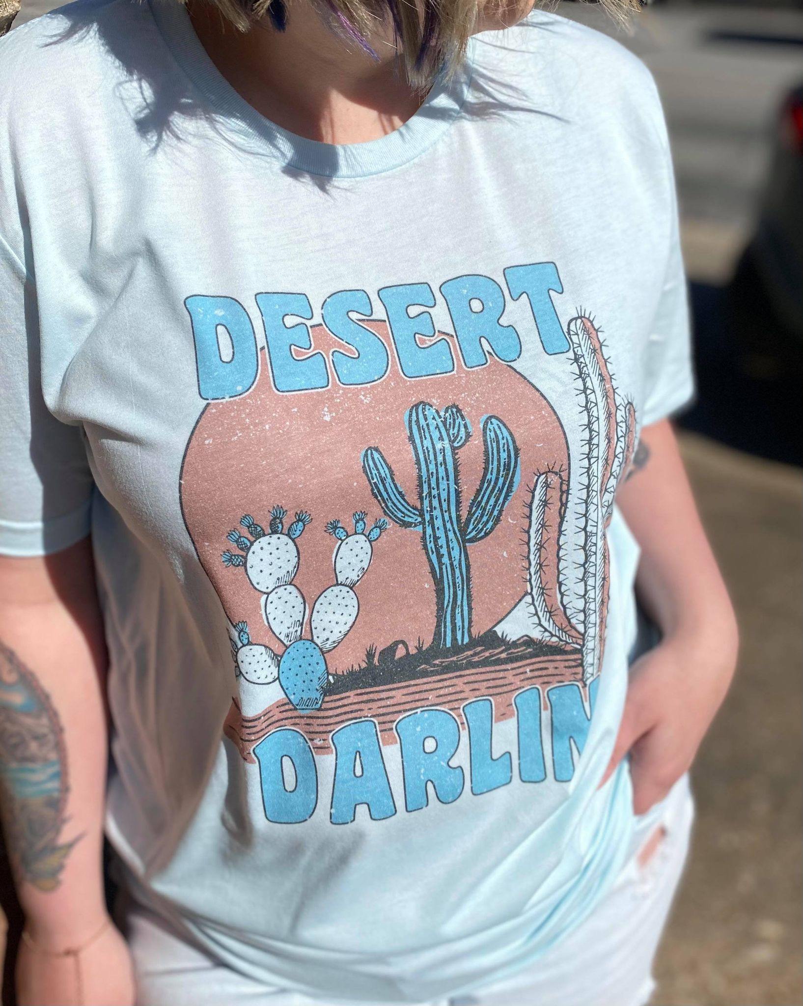 Desert Darlin' T-Shirt featuring a cute sublimated design on a soft fabric, perfect for casual wear.