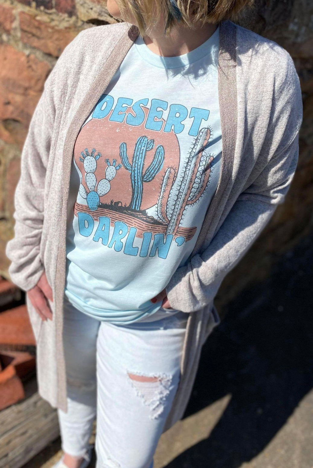 Desert Darlin' T-Shirt featuring a cute sublimated design on a soft fabric, perfect for casual wear.