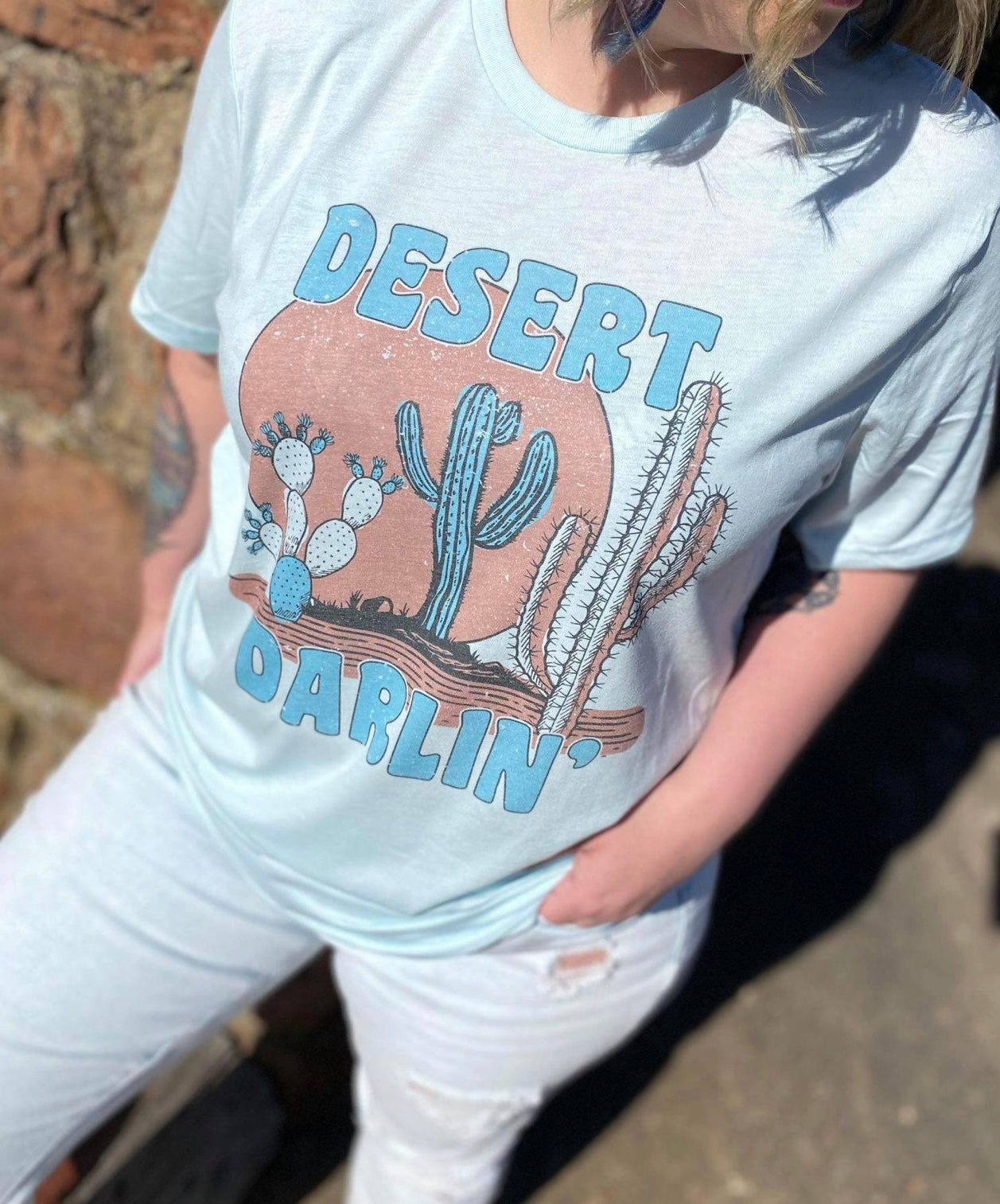 Desert Darlin' T-Shirt featuring a cute sublimated design on a soft fabric, perfect for casual wear.