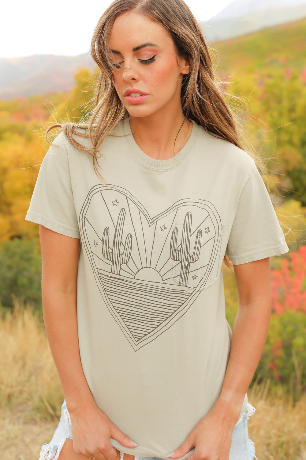 Desert Heart shirt in mint color, made from 100% upcycled cotton, showcasing its stylish design and ethical production.