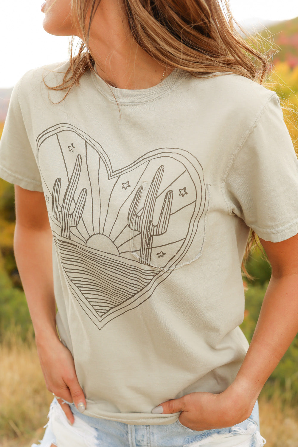 Desert Heart shirt in mint color, made from 100% upcycled cotton, showcasing its stylish design and ethical production.