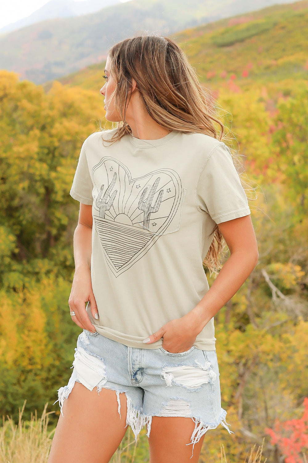 Desert Heart shirt in mint color, made from 100% upcycled cotton, showcasing its stylish design and ethical production.