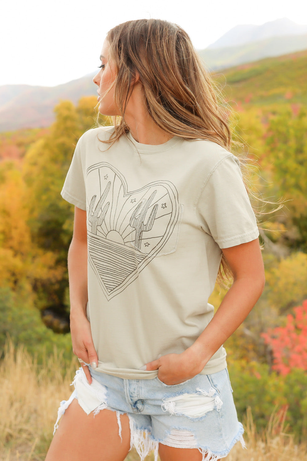 Desert Heart shirt in mint color, made from 100% upcycled cotton, showcasing its stylish design and ethical production.