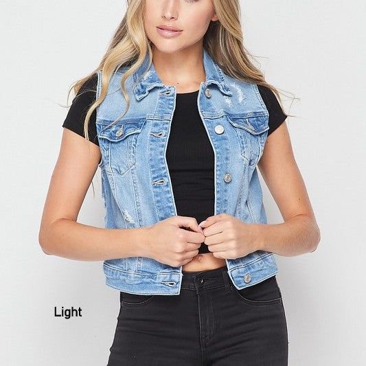 A stylish destructed denim vest featuring a rugged finish, button-up front, and chest pockets, perfect for layering over various outfits.