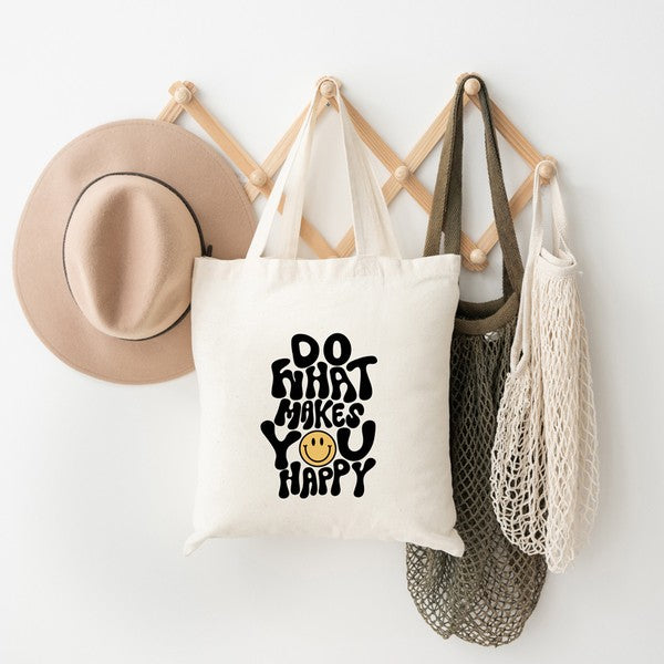 Colorful canvas tote bag with the phrase 'Do What Makes You Happy' printed on it, showcasing a vibrant and cheerful design.