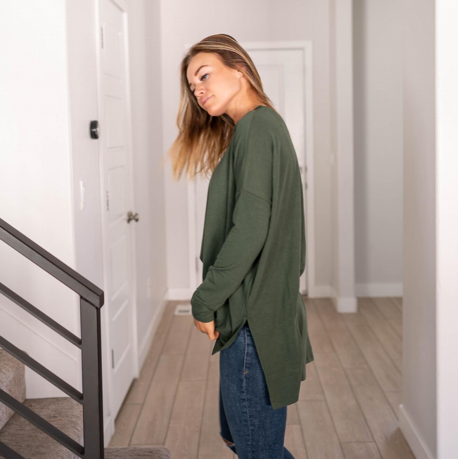 A stylish Dolman Sleeve Round Neck Top with a hi-low hem and side slits, showcasing its relaxed fit and unique silhouette.