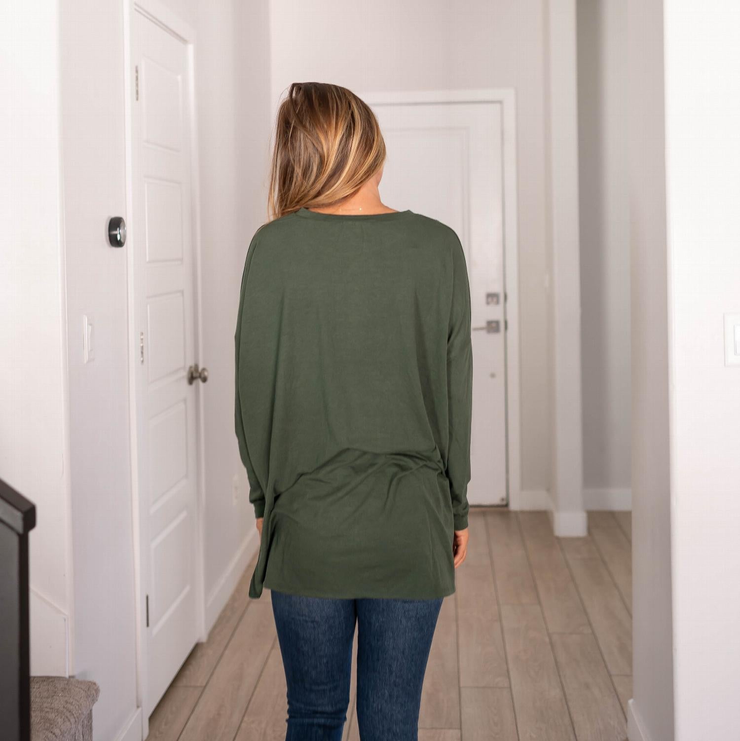 A stylish Dolman Sleeve Round Neck Top with a hi-low hem and side slits, showcasing its relaxed fit and unique silhouette.