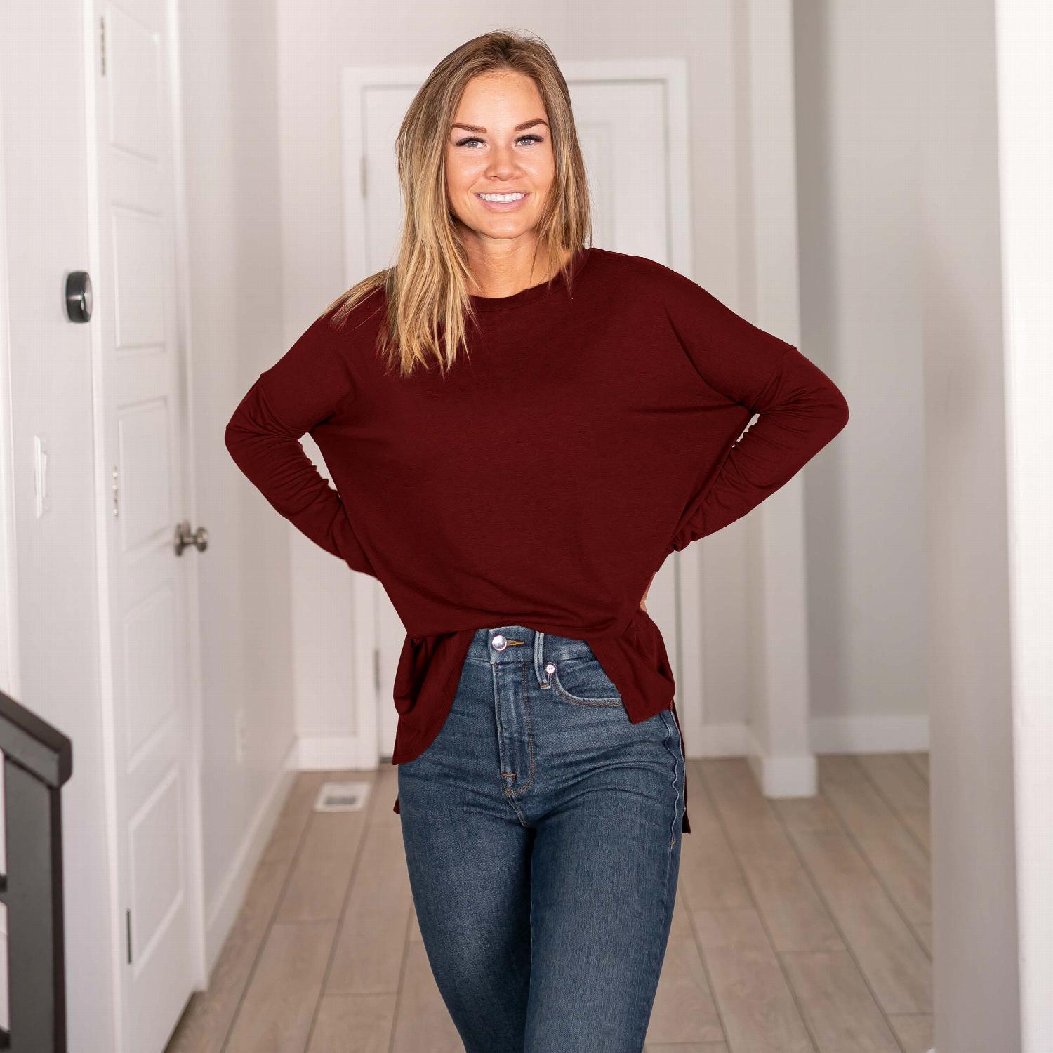 A stylish Dolman Sleeve Round Neck Top with a hi-low hem and side slits, showcasing its relaxed fit and unique silhouette.