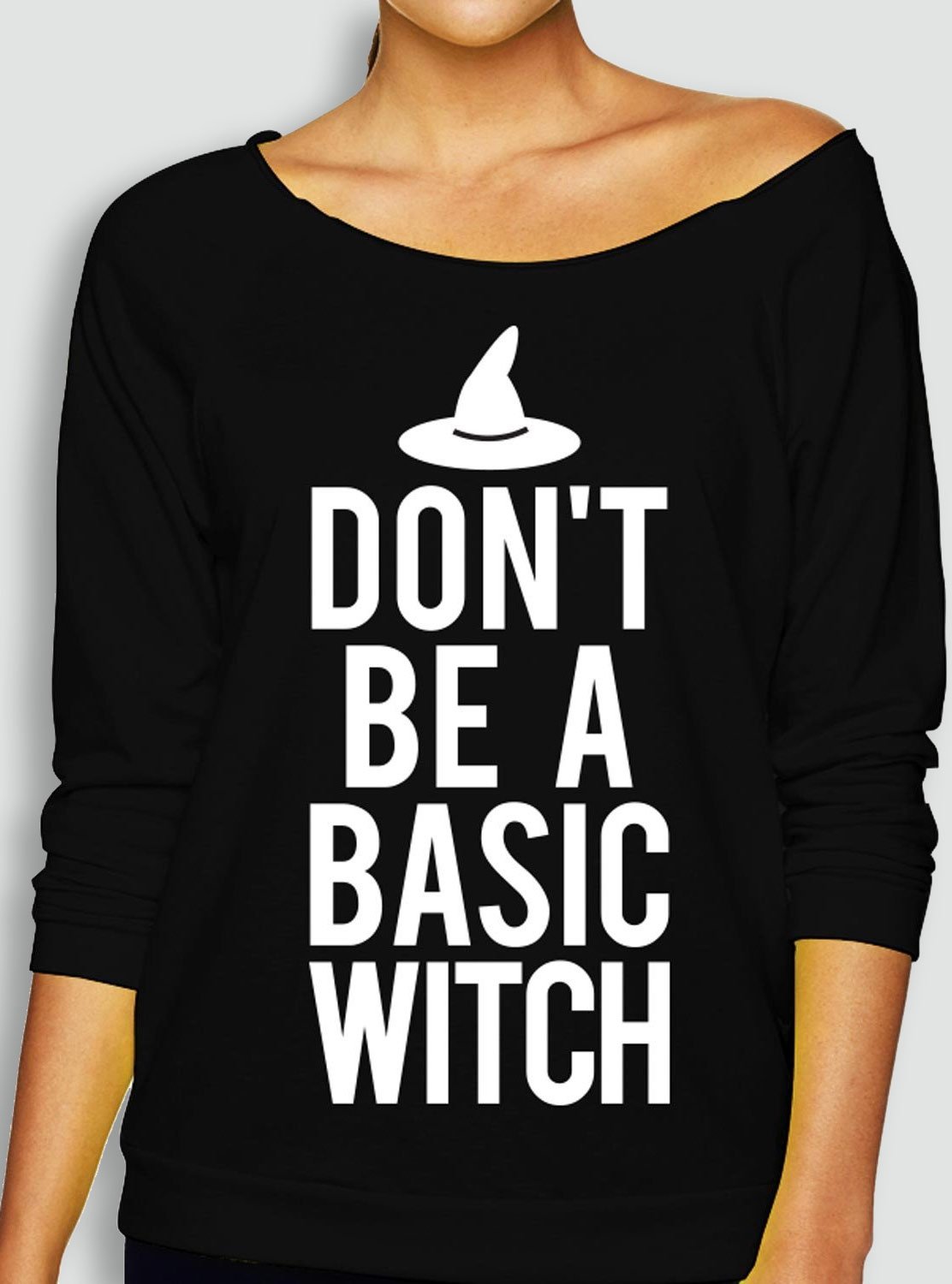 A cozy slouchy sweatshirt featuring the phrase 'DON'T be a BASIC WITCH' in a playful font, perfect for Halloween celebrations.