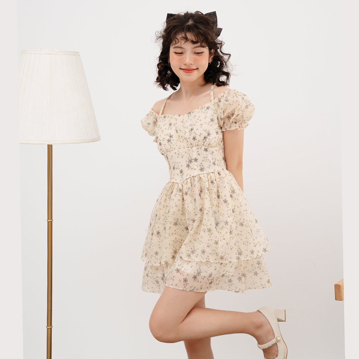 Doris Dress featuring beige silk fabric with baby flower prints and ruffled skirt design.