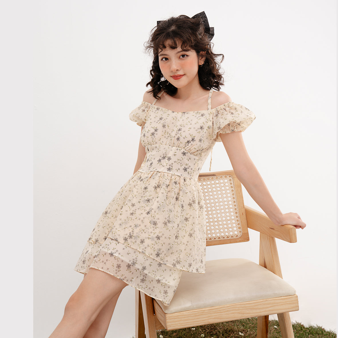 Doris Dress featuring beige silk fabric with baby flower prints and ruffled skirt design.